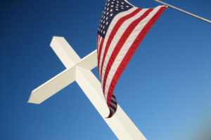 a picture of the american flag and a christian cross