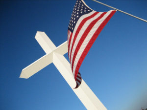 a picture of the american flag and a christian cross