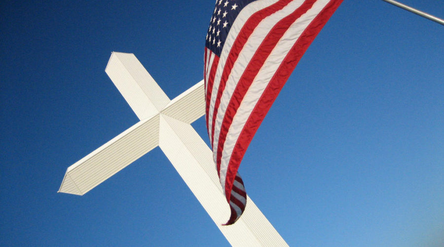 a picture of the american flag and a christian cross