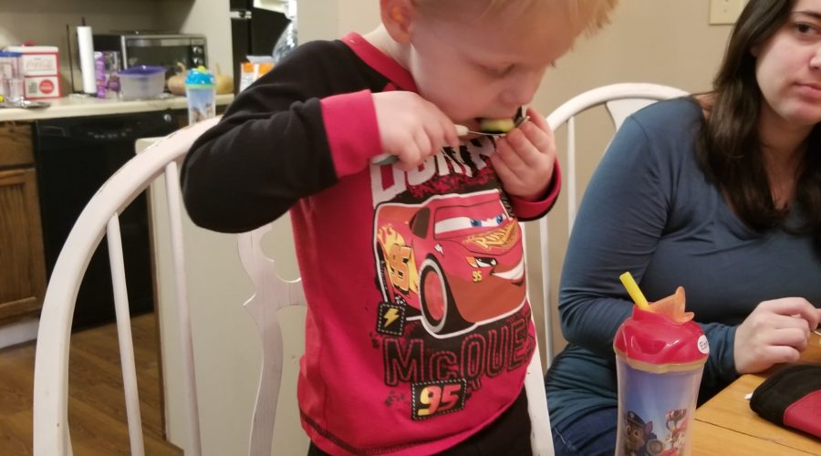 My son eating some zucchini