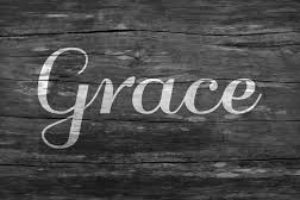 Image of the word grace on hardwood background