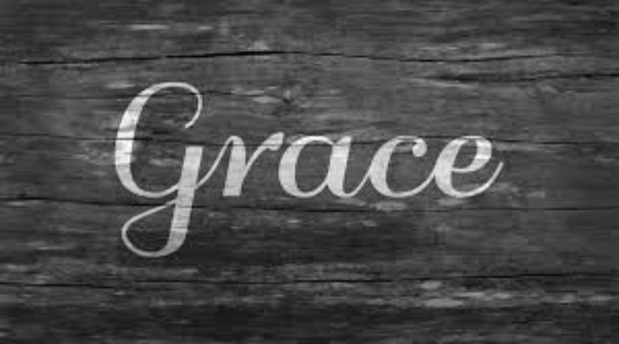 Image of the word grace on hardwood background