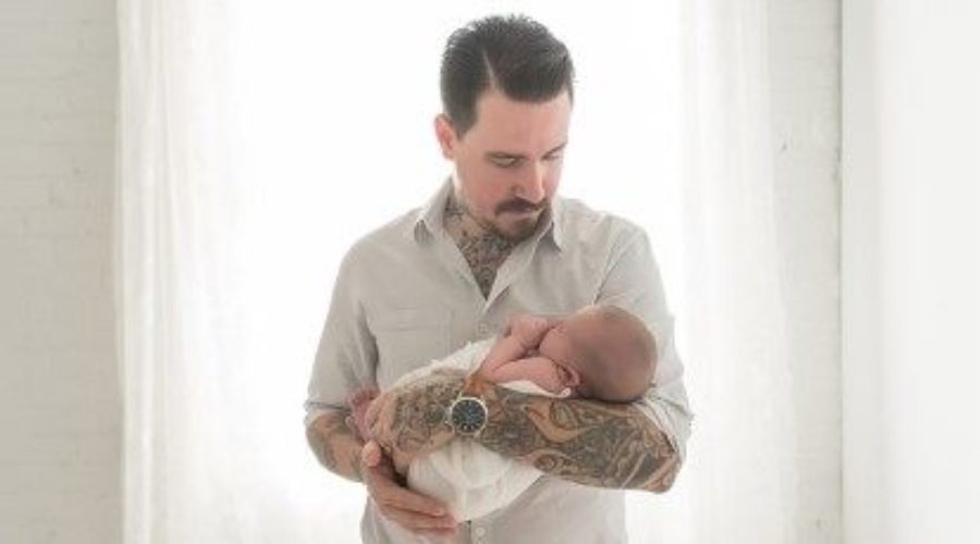 Picture of dad on first night home with baby