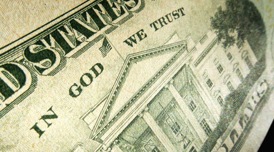 Picture of a 20 dollar bill with the words "In God we Trust" highlighted